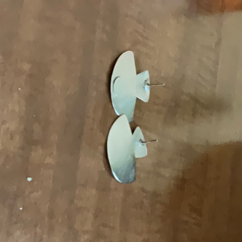 Sterling silver half circle stud earrings.